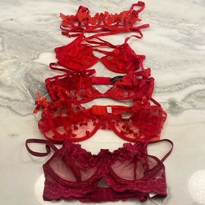 Assortment of shades of red bras 34B/Medium